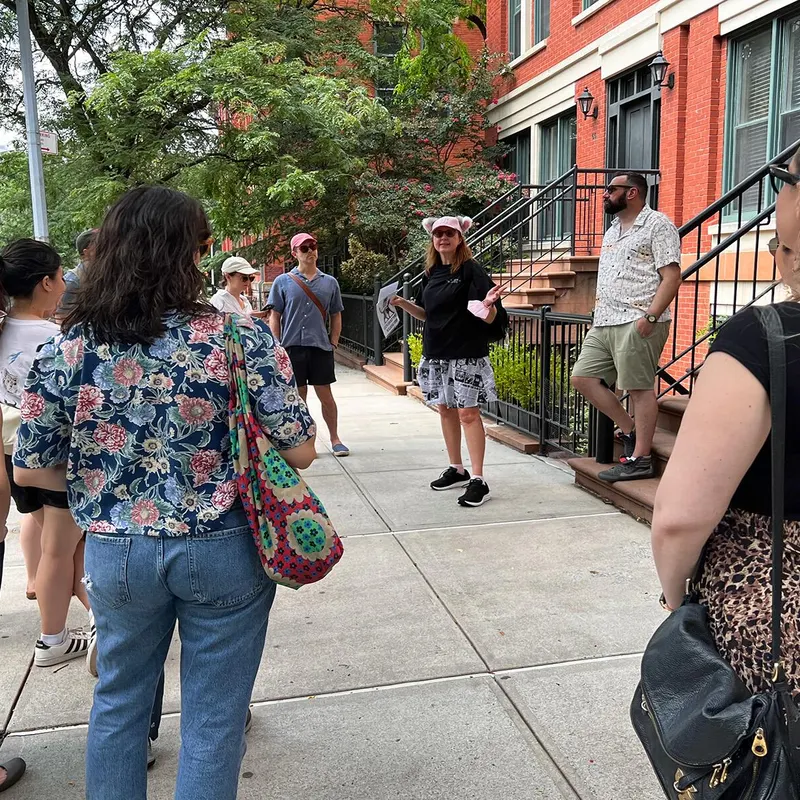 Walking tour group in Brooklyn Heights learning cat history