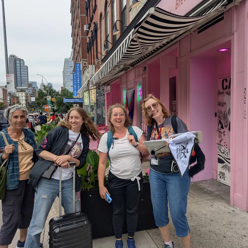 Tour participants outside pink storefront in NYC