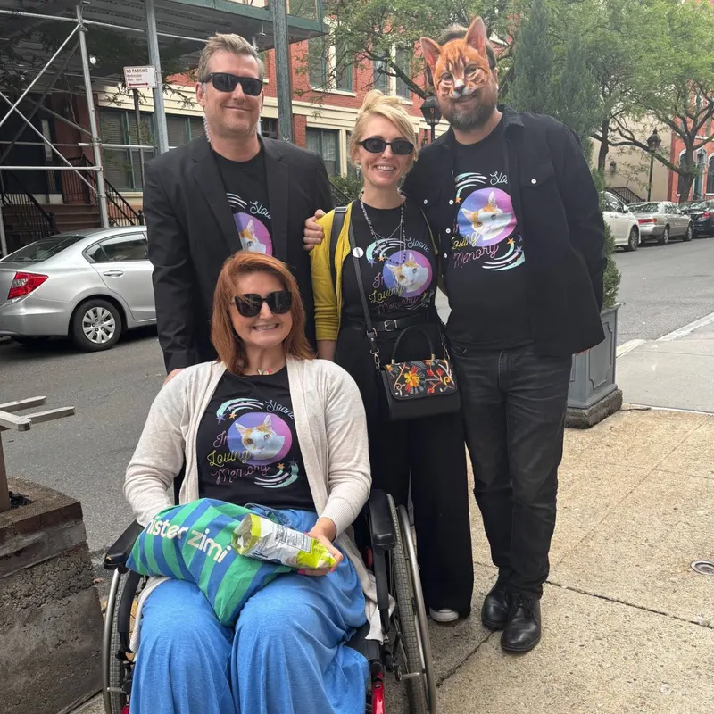 Tour community group wearing matching memorial cat t-shirts