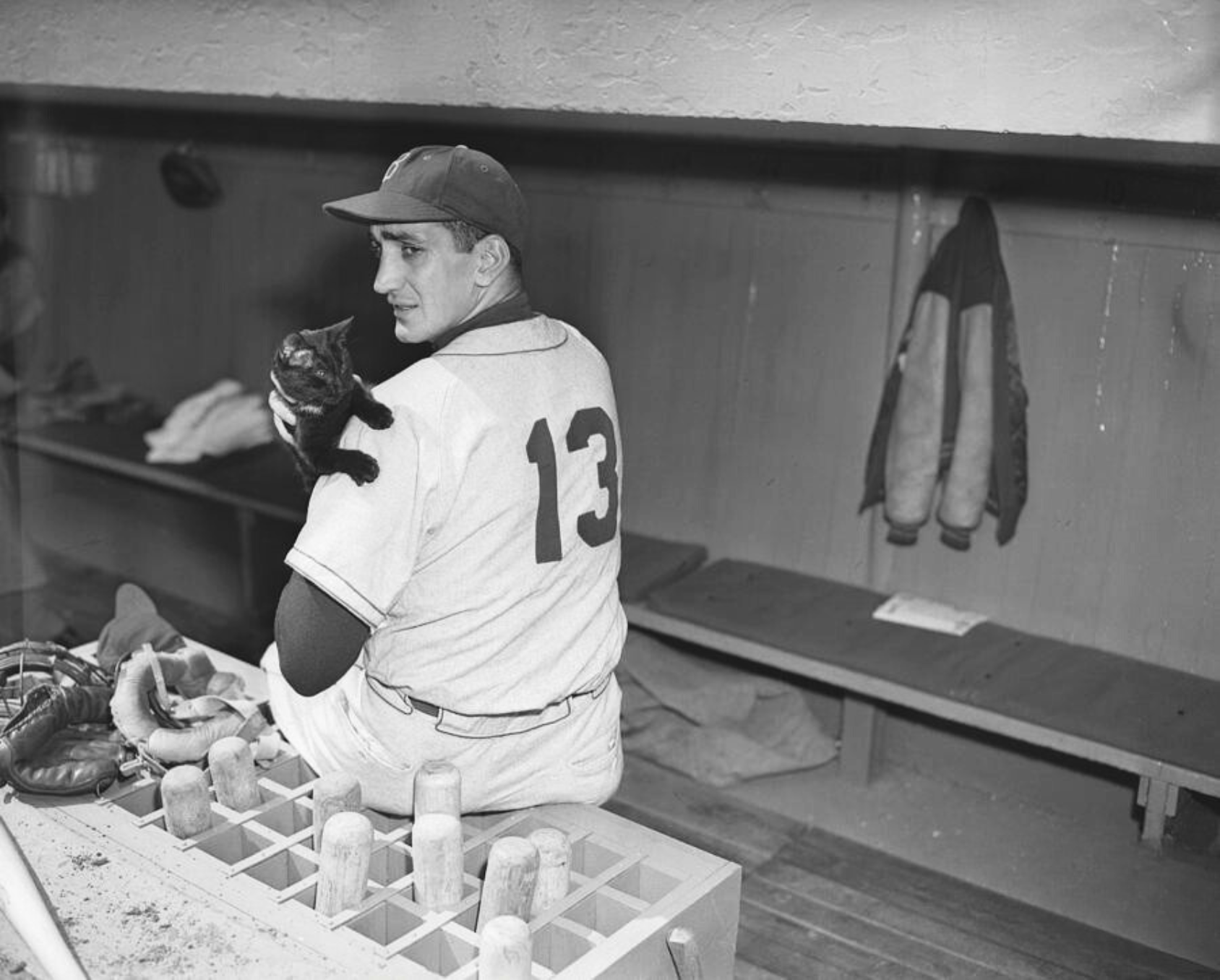 Brooklyn Dodgers pitcher Ralph Branca with a black cat in the Ebbets Field dugout, April 13, 1951